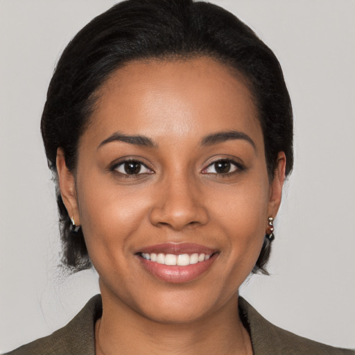 Joyful latino young-adult female with medium  black hair and brown eyes