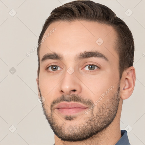 Joyful white young-adult male with short  brown hair and brown eyes