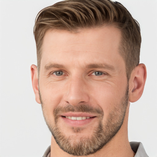 Joyful white adult male with short  brown hair and grey eyes