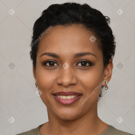 Joyful black young-adult female with short  black hair and brown eyes