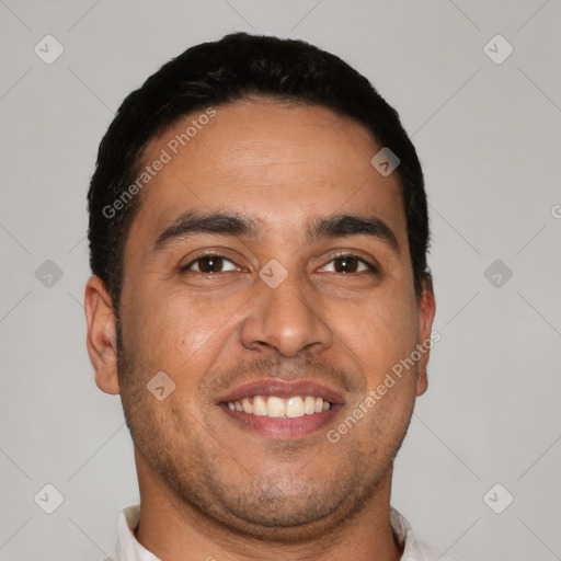 Joyful latino young-adult male with short  brown hair and brown eyes