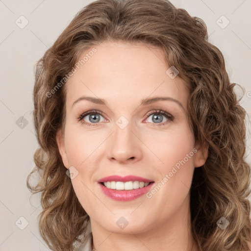 Joyful white young-adult female with medium  brown hair and green eyes