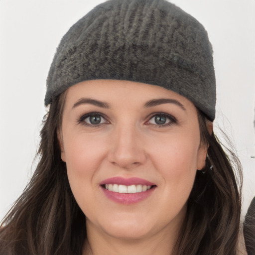 Joyful white young-adult female with long  black hair and grey eyes