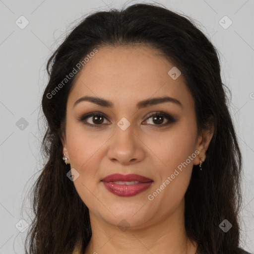 Joyful latino young-adult female with long  brown hair and brown eyes