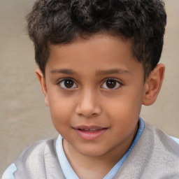 Joyful white child male with short  brown hair and brown eyes