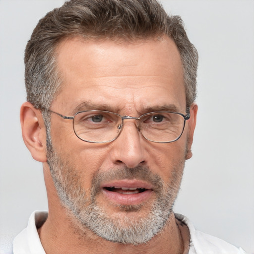 Joyful white middle-aged male with short  brown hair and brown eyes