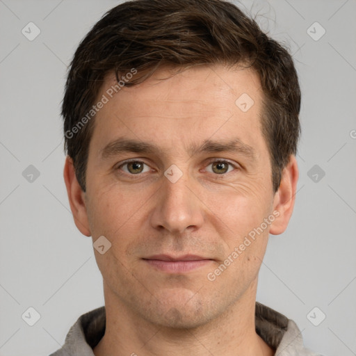 Joyful white adult male with short  brown hair and grey eyes