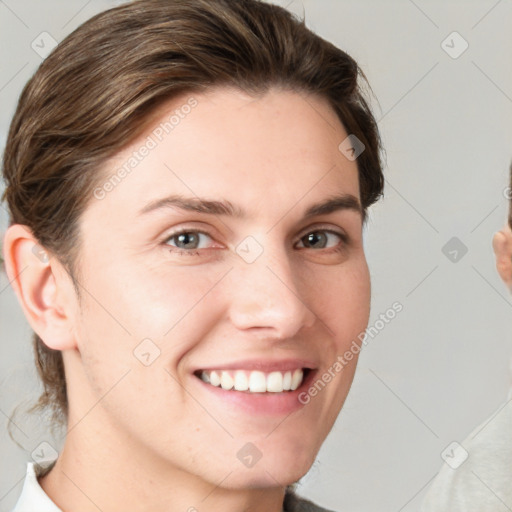 Joyful white young-adult female with short  brown hair and grey eyes