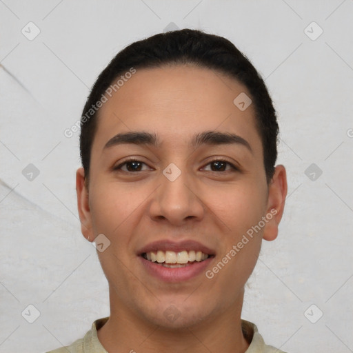 Joyful white young-adult male with short  black hair and brown eyes