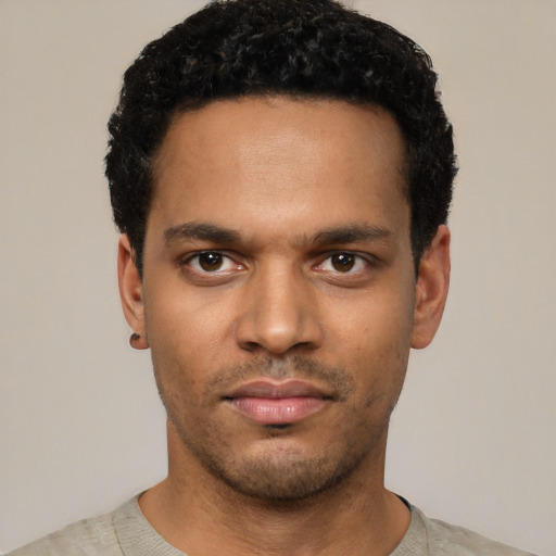 Neutral black young-adult male with short  black hair and brown eyes