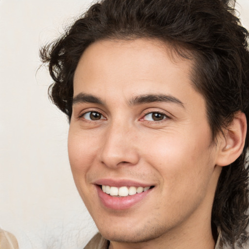 Joyful white young-adult male with medium  brown hair and brown eyes