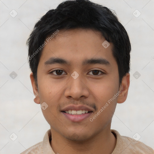 Joyful white young-adult male with short  black hair and brown eyes