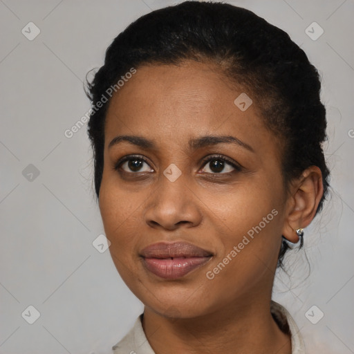 Joyful black young-adult female with short  black hair and brown eyes