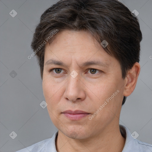 Joyful white adult male with short  brown hair and brown eyes