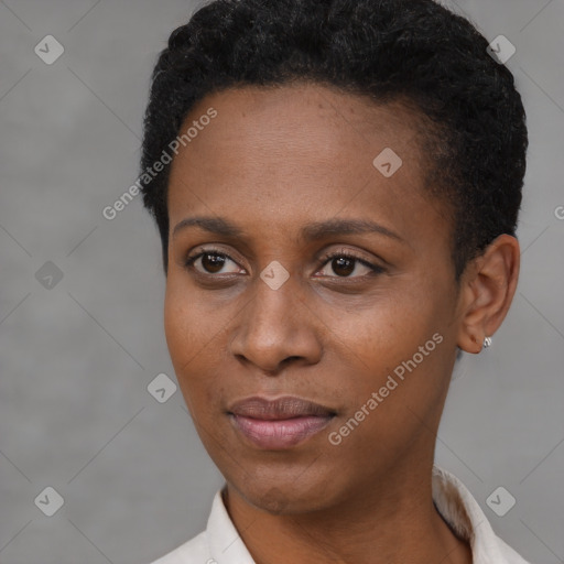 Joyful black young-adult female with short  black hair and brown eyes