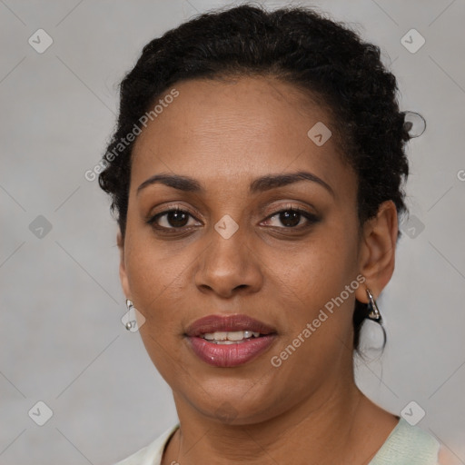 Joyful latino adult female with short  brown hair and brown eyes