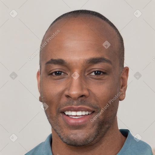 Joyful black young-adult male with short  brown hair and brown eyes