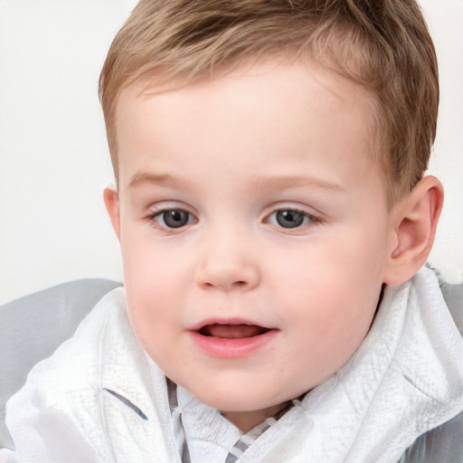 Joyful white child male with short  brown hair and blue eyes