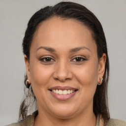 Joyful white adult female with medium  brown hair and brown eyes