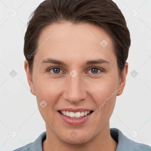 Joyful white young-adult female with short  brown hair and grey eyes