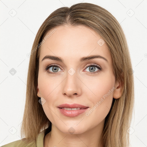 Joyful white young-adult female with long  brown hair and green eyes