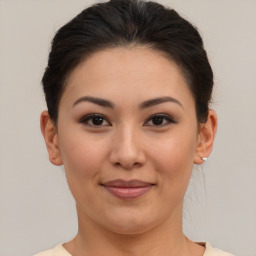 Joyful asian young-adult female with medium  brown hair and brown eyes