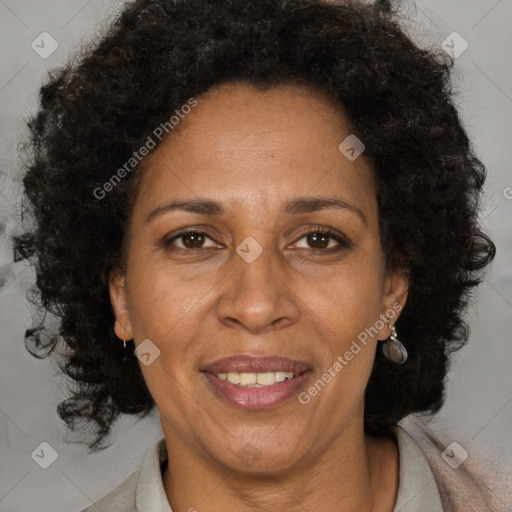 Joyful black adult female with medium  brown hair and brown eyes