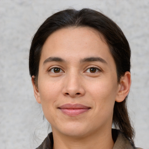 Joyful white young-adult female with medium  brown hair and brown eyes