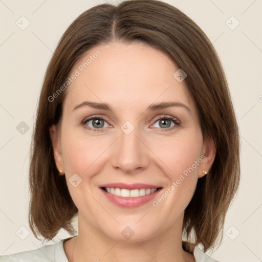 Joyful white young-adult female with medium  brown hair and green eyes