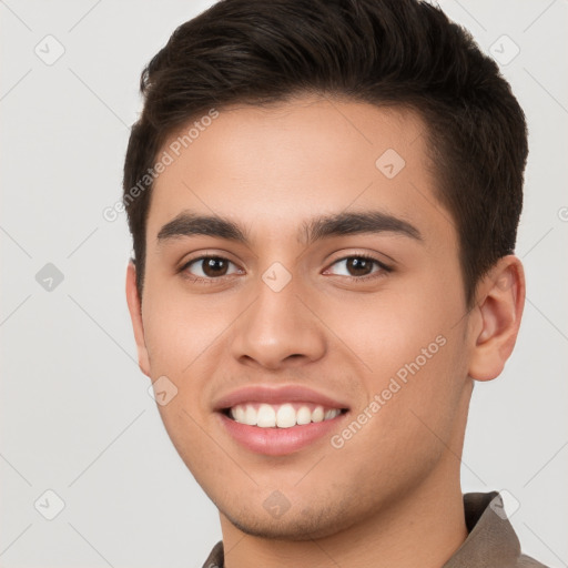 Joyful white young-adult male with short  brown hair and brown eyes