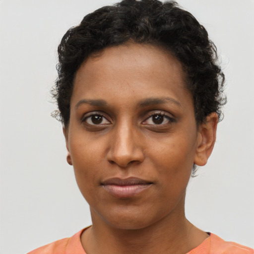 Neutral black young-adult female with short  brown hair and brown eyes