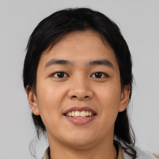Joyful asian young-adult female with medium  black hair and brown eyes