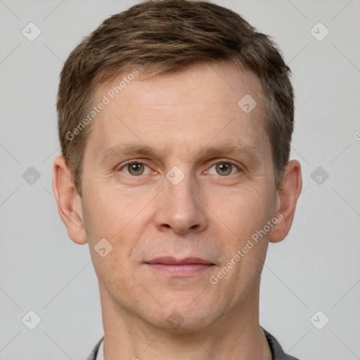 Joyful white adult male with short  brown hair and grey eyes