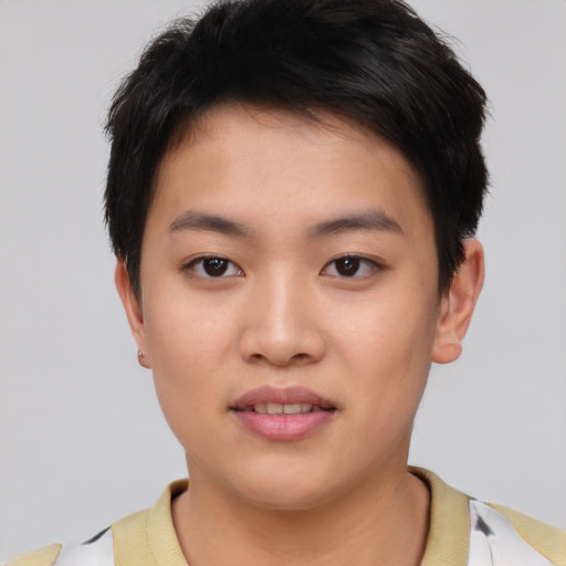 Joyful asian young-adult female with short  black hair and brown eyes