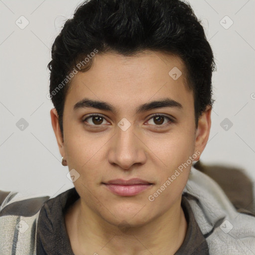 Joyful latino young-adult male with short  brown hair and brown eyes