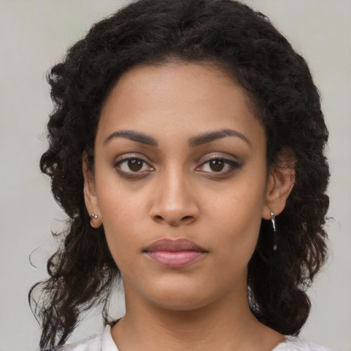 Neutral latino young-adult female with long  black hair and brown eyes