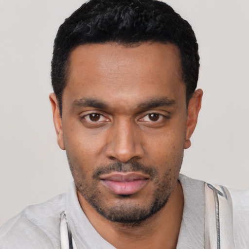 Neutral black young-adult male with short  black hair and brown eyes