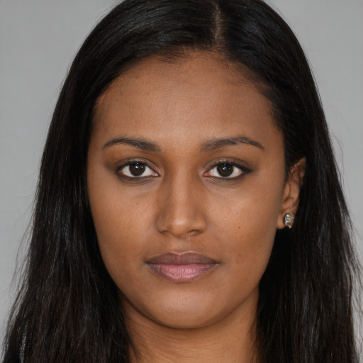 Joyful asian young-adult female with long  brown hair and brown eyes