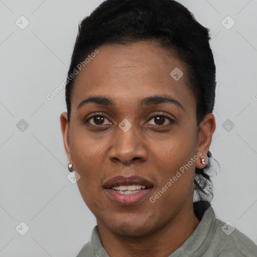 Joyful black young-adult female with short  black hair and brown eyes