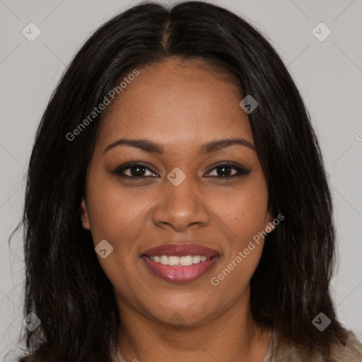 Joyful black young-adult female with long  brown hair and brown eyes