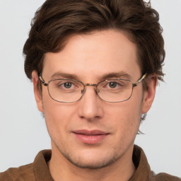 Joyful white adult male with short  brown hair and grey eyes