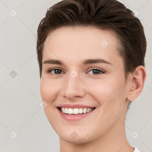 Joyful white young-adult female with short  brown hair and brown eyes