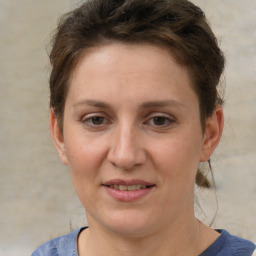 Joyful white adult female with short  brown hair and grey eyes