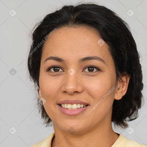 Joyful latino young-adult female with medium  brown hair and brown eyes