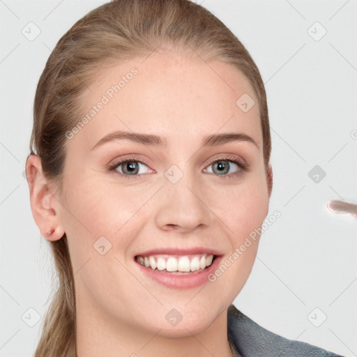 Joyful white young-adult female with long  brown hair and blue eyes