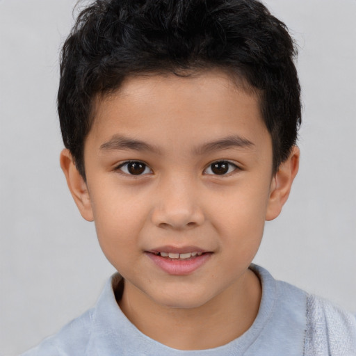 Joyful white child male with short  brown hair and brown eyes