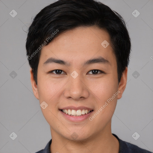 Joyful asian young-adult male with short  black hair and brown eyes