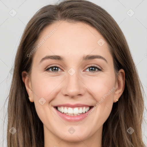 Joyful white young-adult female with long  brown hair and grey eyes