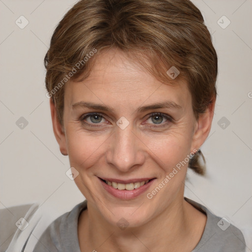 Joyful white adult female with short  brown hair and grey eyes