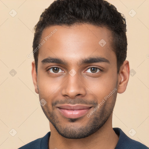 Joyful black young-adult male with short  brown hair and brown eyes